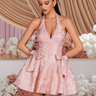 Pink floral halter mini dress with corset-style seams and skirt bow accents