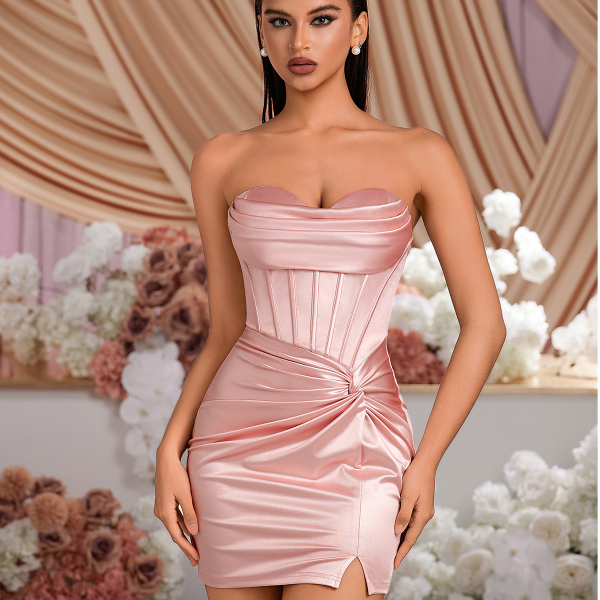 Pink satin corset mini dress with sweetheart neckline and ruched twisted waist.